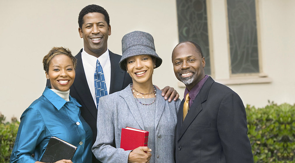 group of people holding bibles