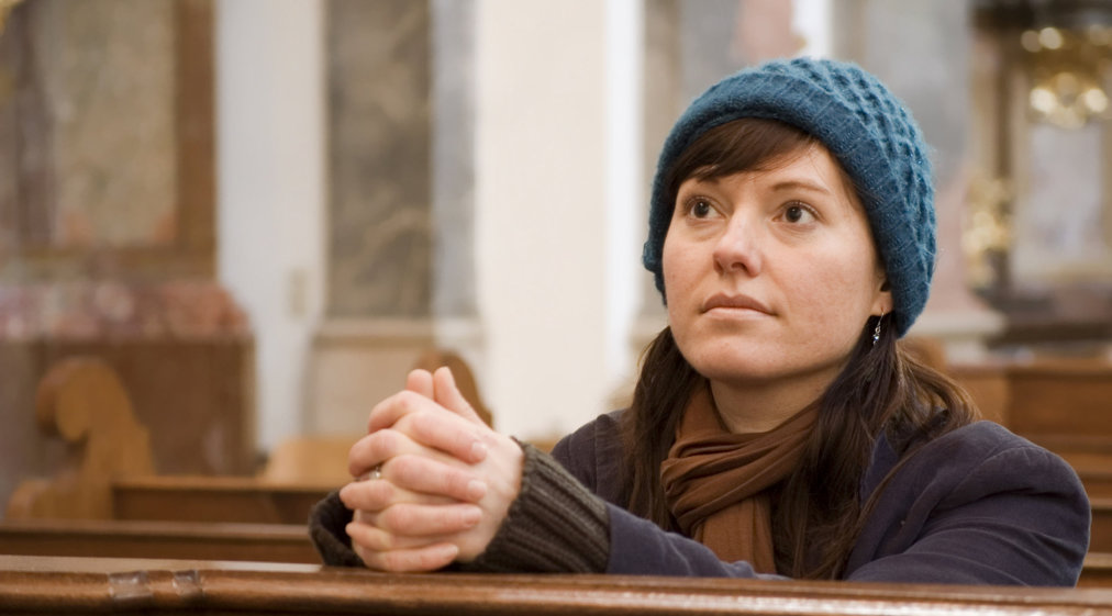 woman praying on church