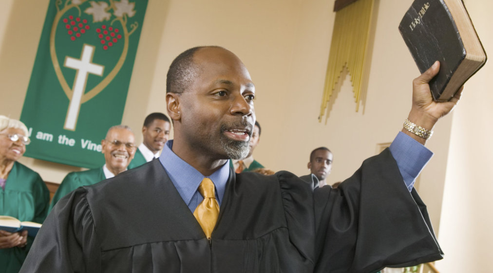 preacher preaching the gospel in church