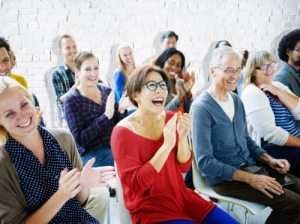 people happily clapping their hands